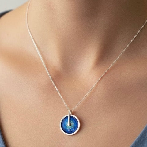 Blue and Turquoise cloisonne enamel spinning pendant handmade by Laura Haszard