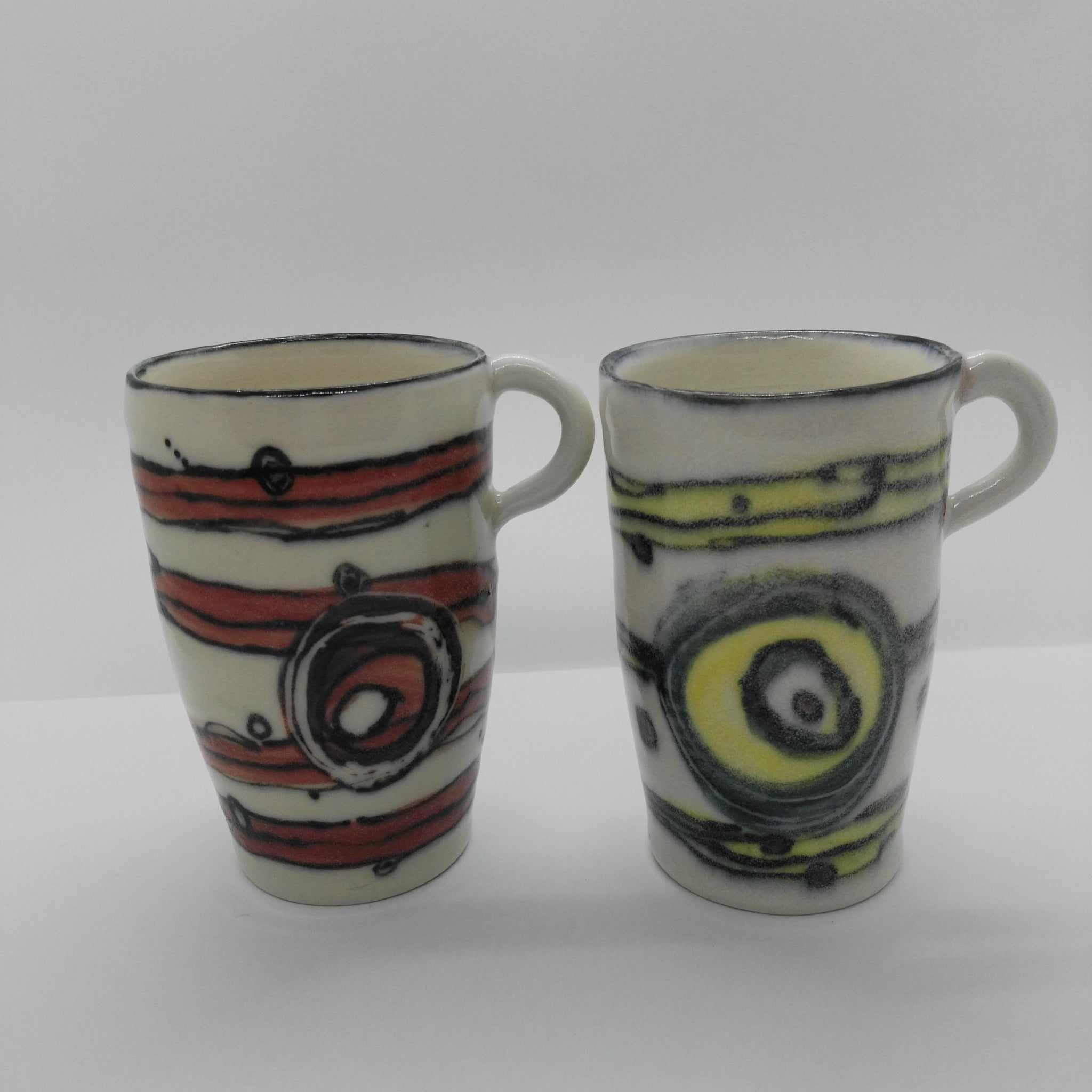 Purchase separately Ceramic mugs (red & green) hand made by Heidi Francis.