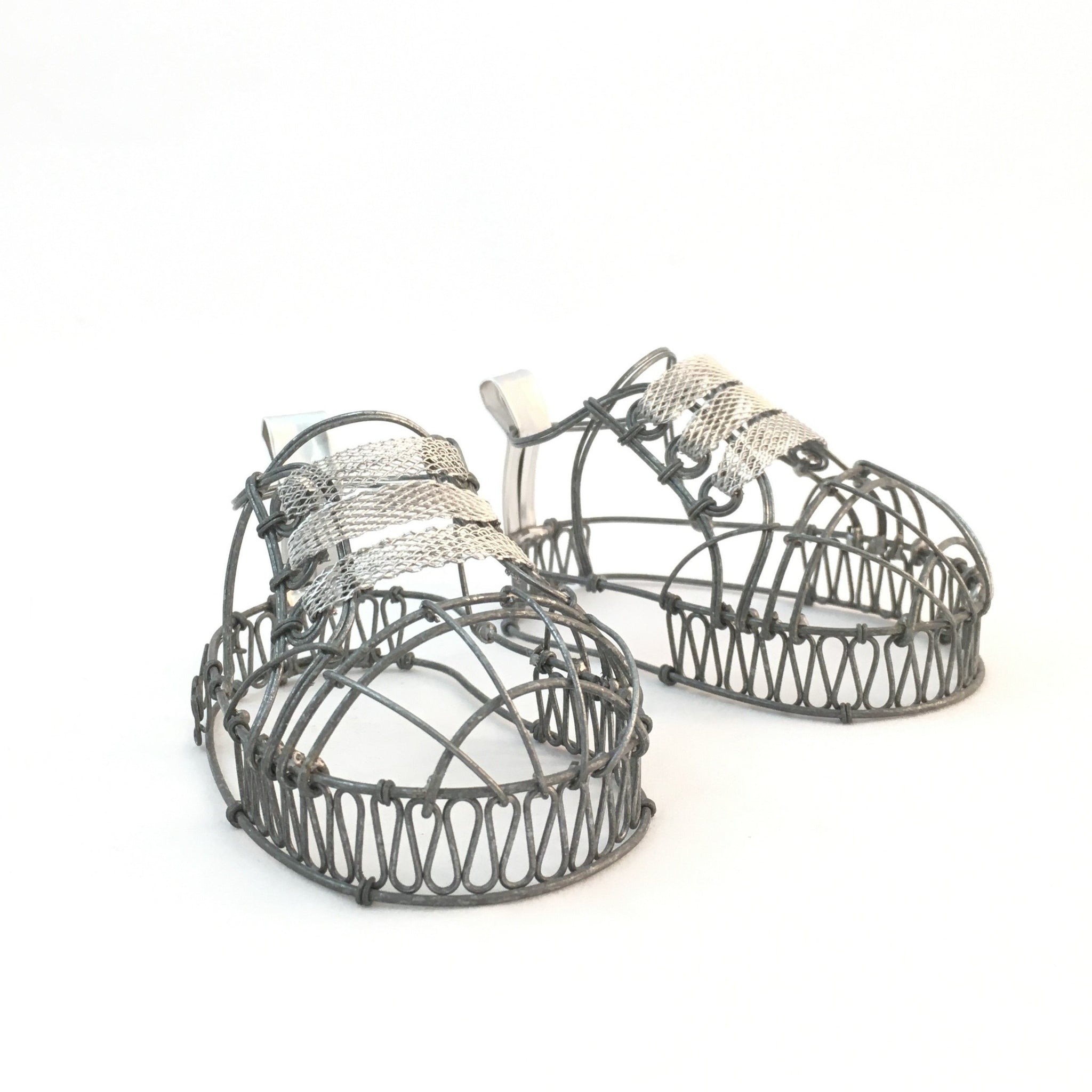 Wire baby shoes by Natalie Fong